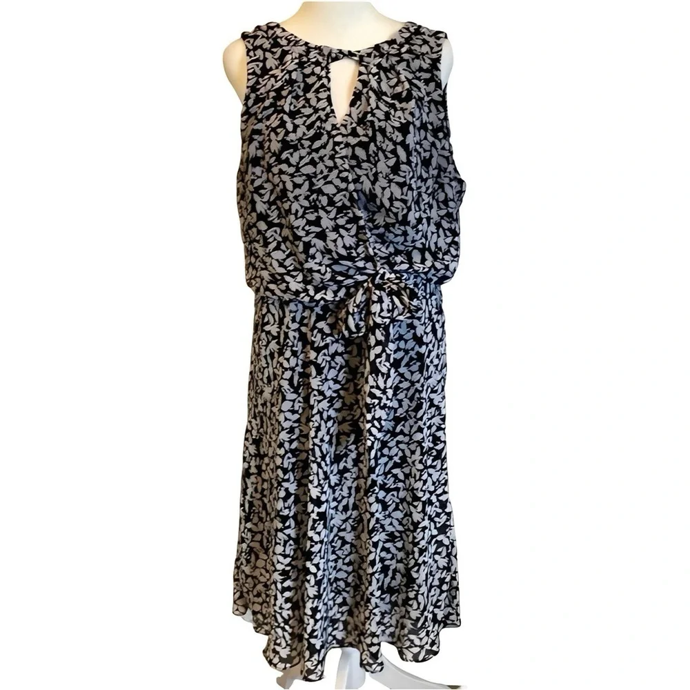 Karin Steven’s sleeveless black/white patterned lined dress. Tie at neck & waist